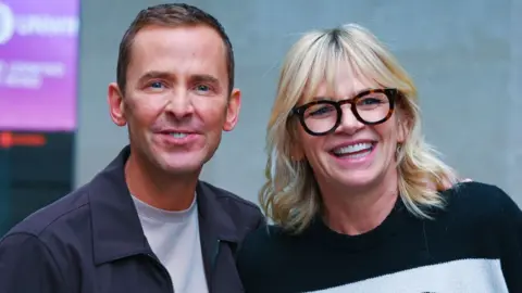 Scott Mills and Zoe Ball pictured outside the BBC's New Broadcasting House in November 2024