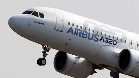 Reuters A plane with nose pointing up. It features blue writing on it, which says Airbus A320 and grey letters NEO.
