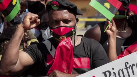 Getty Images An Ipob member with raised fist