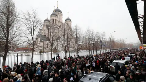 EPA Russian people follow the hearse with the coffin of late Russian opposition leader Alexei Navalny outside the Church of the Icon of the Mother of God