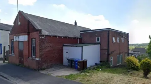 Google Street view image of the existing red brick building