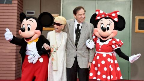 (L-R) Mickey Mouse, Elizabeth Sherman, Songwriter Richard M. Sherman and Minnie Mouse attend the dedication and re-naming of the historic Orchestra Stage, now the Sherman Brothers Stage A, on the Disney Burbank lot prior to the world premiere of Disney's 'Christopher Robin' at the studio's Main Theater, on July 30, 2018. 