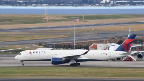 Photo by James D. Morgan/Getty Images A Delta Airlines Airbus A-350 aircraft taxis on Sydney Airport's runway