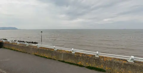 A Google maps view of the sea from the beach promenade. The tide is in. 