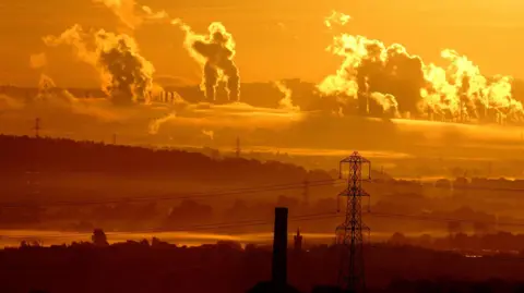The sun rising over the fumes from the Grangemouth industrial complex 