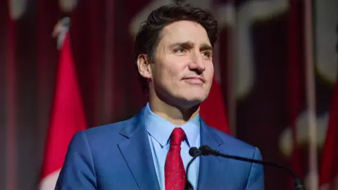 Getty Images Justin Trudeau speaks during the Liberal holiday party in December