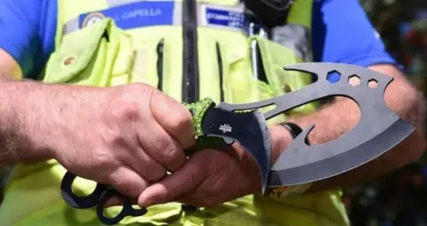 PA Media PCSO holds a zombie knife