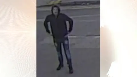 West Yorkshire Police CCTV image of man wearing a hoodie and ripped jeans