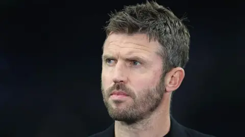 Michael Carrick stares to the left