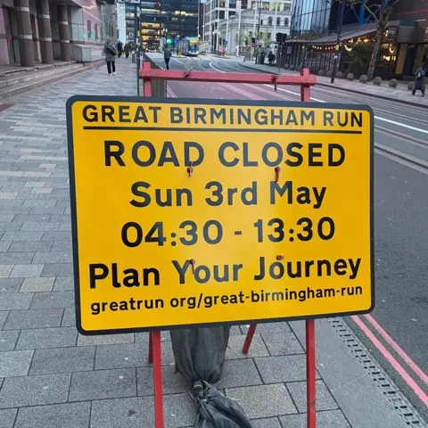 Birmingham City Council A yellow road closure sign for the Great Birmingham Run.