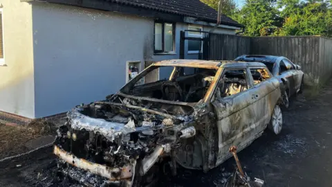 Burnt out cars in Trimley St Martin