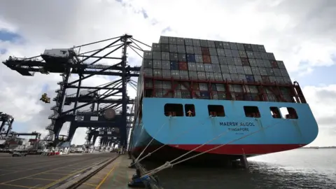 Getty Images A container ship waits to be unloaded at Felixstowe port on October 17, 2013 in Felixstowe, England