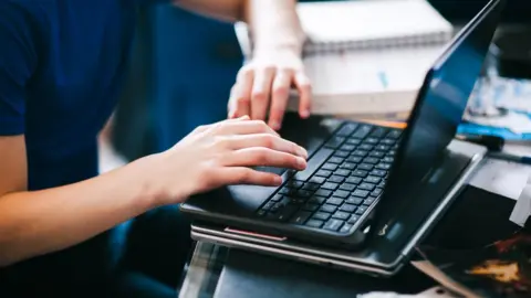 Getty Images Person using laptop