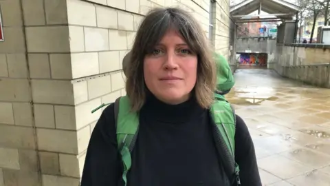 Sam Read/BBC Bethany Mogie outside court with a large camping style rucksack on her back