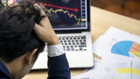 Getty Images Stock market trader