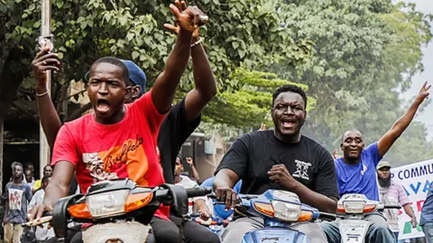 EPA People on motorbikes in Bamako celebrating the military takeover in Mali - August 2020