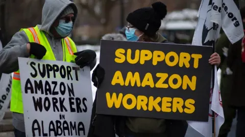 Getty Images People with placards