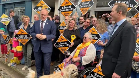 PA Media Lib Dem leader Ed Davey and party supporters