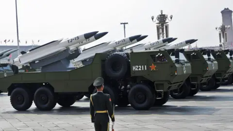 ANDRES MARTINEZ CASARES/EPA/Shutterstock Armoured vehicles carrying the YJ-15 supersonic anti-ship cruise missile are seen during the military parade