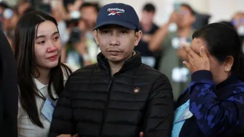 Reuters Relatives of Sathian Suwannakham, one of the released Thai hostages, who was kidnapped during the deadly October 7, 2023 attack by Hamas and held in Gaza, react as the hostages arrived in Thailand following their release