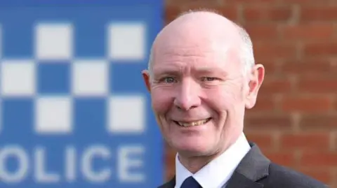 Conservative party Profile picture of Darryl Preston with police sign in the background