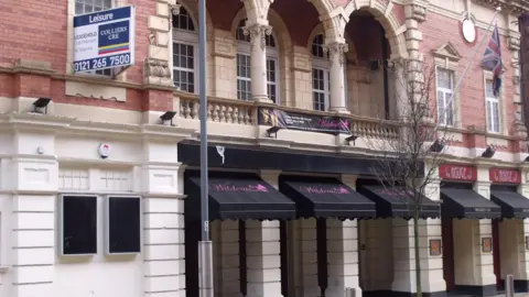 Elliott Brown The building back in February 2010 when it was an adult bar. It is an early example of cinema architecture with brick, stone and terracotta dressings. Here, it has black and pink canvas covers.