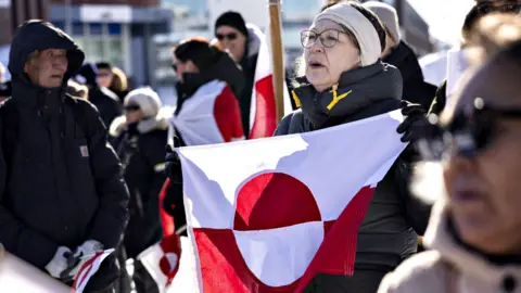 Protesters attend a march to the US consulate during a demonstration, under the slogan 'Greenland belongs to the Greenlandic people', in Nuuk, Greenland, on March 15, 2025. 