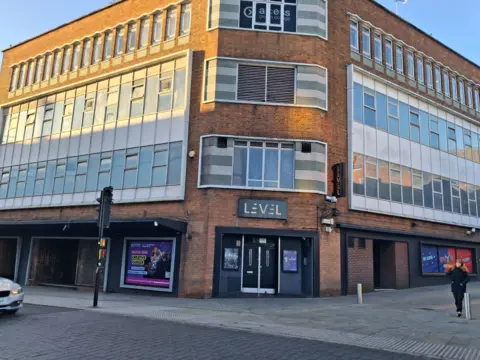 Local Democracy Reporting Service The former Level nightclub in Lincoln. It is a three storey building with grey panelling around the rows of windows. The building stands on a street corner with two black doors visible in the centre.