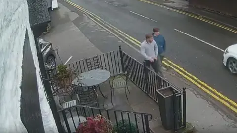 Lancashire Police CCTV of the two men walking round the front of the pub to the entrance.