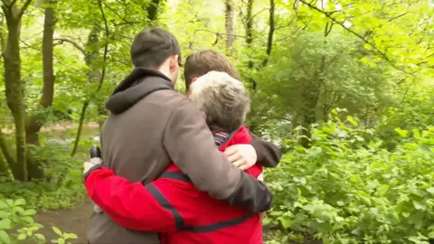 Helen hugging Aiden and Jacob
