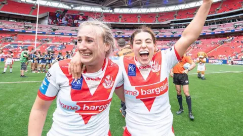 St Helens's Jodie Cunningham and Emily Rudge celebrate victory over Leeds in the Women's Challenge Cup final