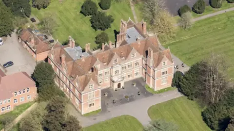 A bird's eye view of Shaw House from the air.