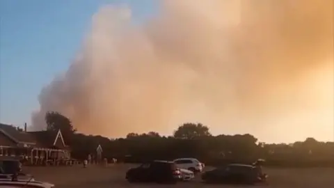 Smoke fills the air from a fire.