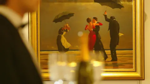 Getty Images Painting The Singing Butler, shows a couple in evening attire dances on the wet sand of a Fife shoreline, grey clouds hanging low above the horizon.
