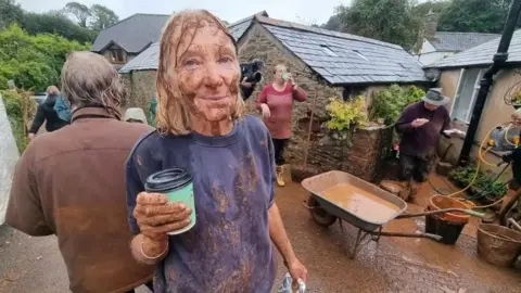 BBC A lady whose home had been flooded