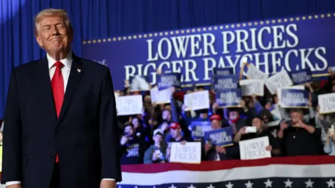 President Donald Trump takes the stage to speak during a rally at the Horizon Events Center.