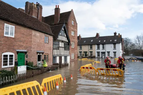 PA Media Search and rescue teams check on residents in Bewdley