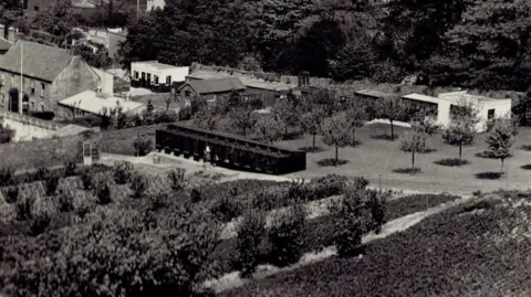 JSPCA Historic aerial view of an animal shelter and surrounding gardens, photographed in 1938.