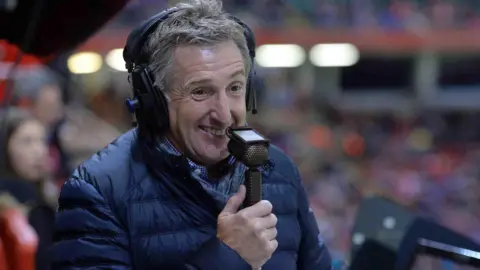 Jonathan Davies with a microphone