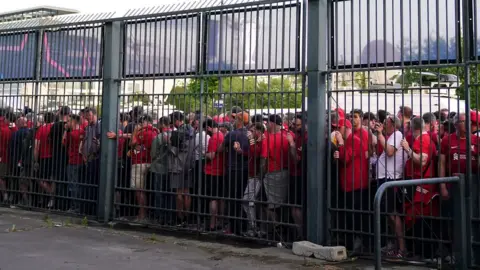 PA Media Liverpool fans stuck outside the ground as the kick off is delayed