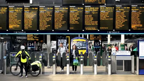 PA Media passengers in Waverley Station