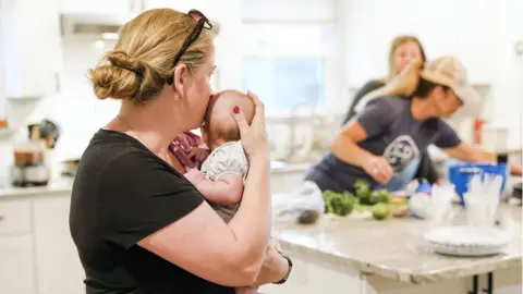 Aubrey Schlackman and the mothers get together to cook a community meal