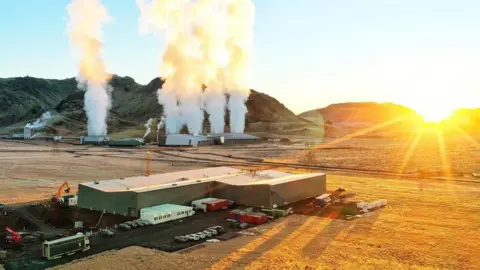 Vaxa steam vents from a geothermal power plant, in the foreground is the VAXA plant.