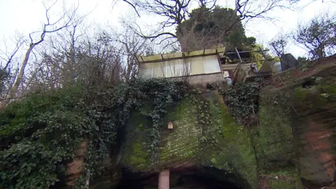 Part of house set in a rock face