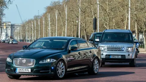 Getty Images Theresa May in a Jaguar