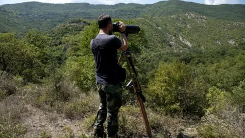 ALEXANDROS AVRAMIDIS A police patrol surveys the border