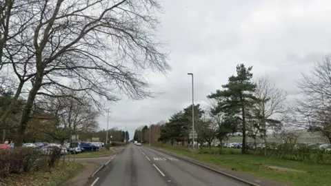 Google Streetview image of Straight Mile passing HMP Ranby, with car parks on either side