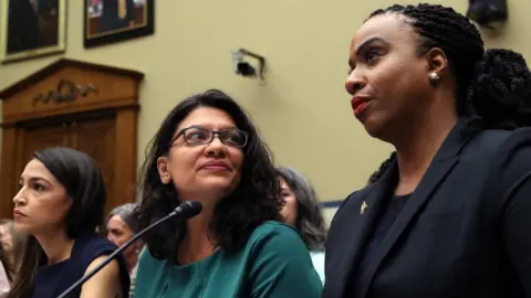 Getty Images Alexandria Ocasio-Cortez (left), Rashida Tlaib (centre) and Ayanna Pressley (right)