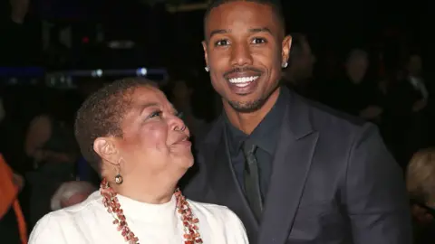 Getty Images Donna Jordan looks up at her son Michael B Jordan admiringly 