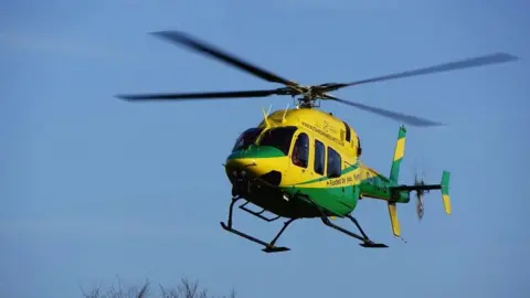 A Wiltshire Air Ambulance helicopter in air